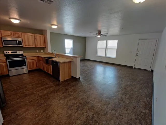 a kitchen with a stove and a microwave