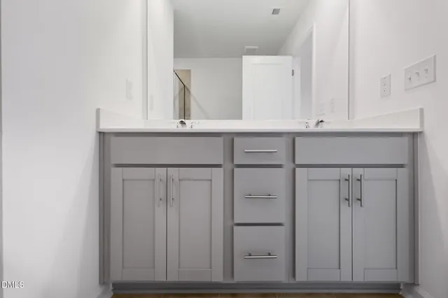 a view of cabinets with wooden floor