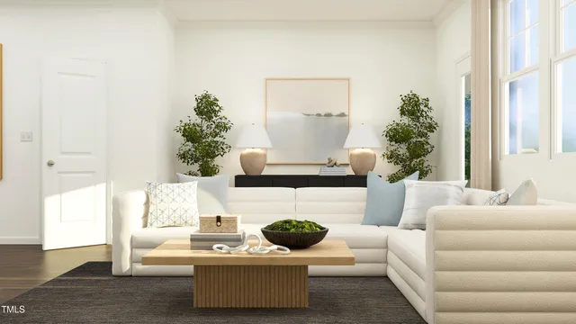 a living room with furniture a window and a flat screen tv