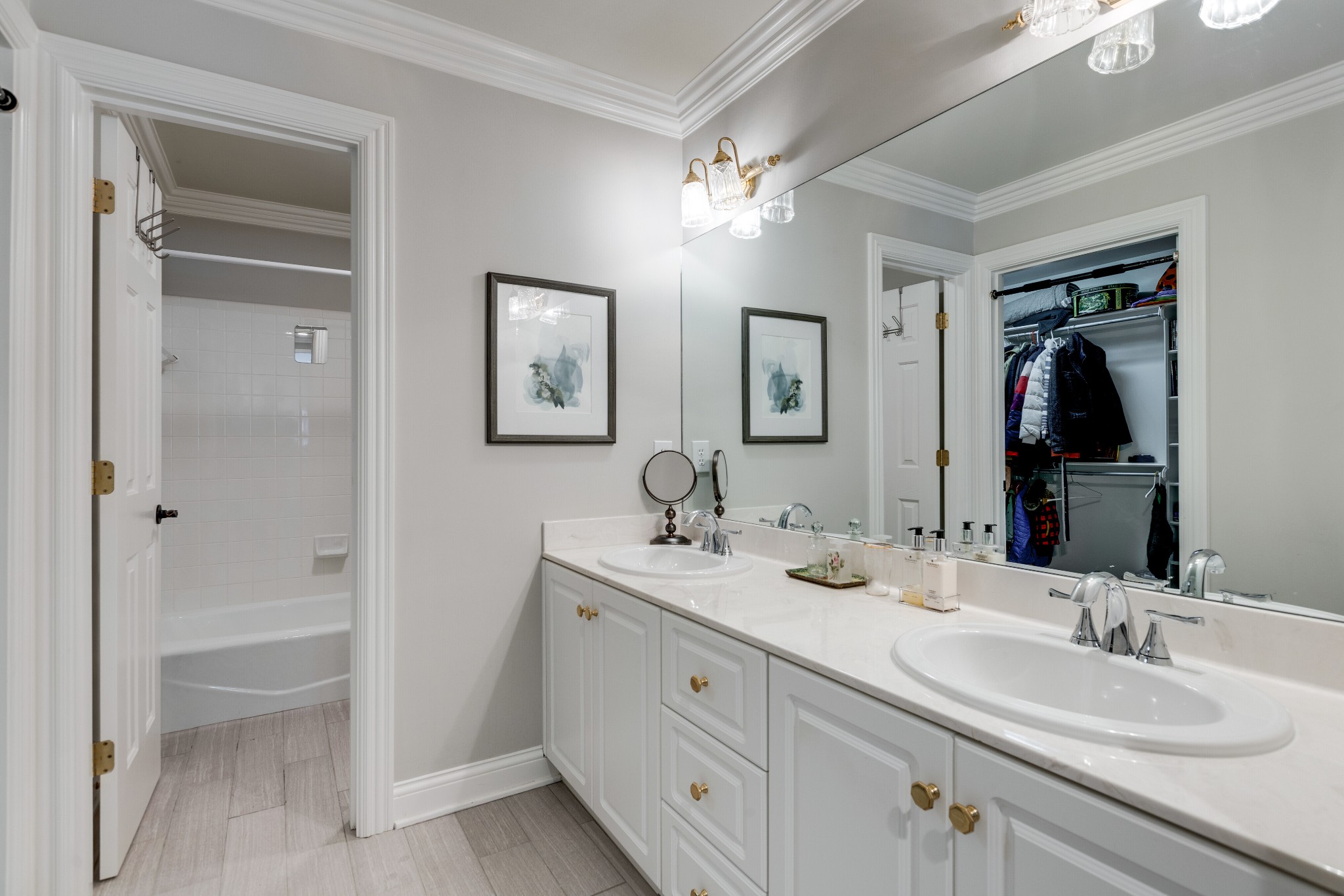 232 Bramerton Court Franklin, TN 37069 - Photo 30 of 58 a bathroom with a double vanity sink and a mirror