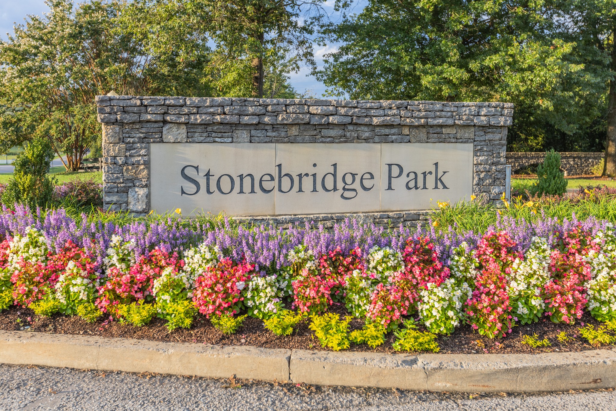 232 Bramerton Court Franklin, TN 37069 - Photo 4 of 58 a view of sign board with flowers