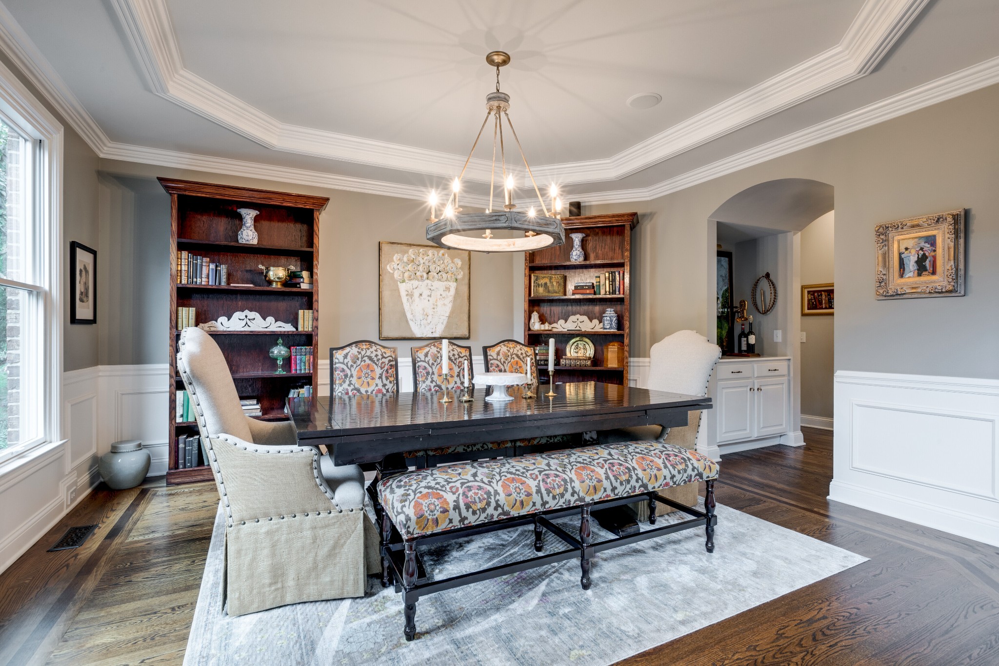 232 Bramerton Court Franklin, TN 37069 - Photo 8 of 58 a living room with furniture a chandelier and a bookshelf