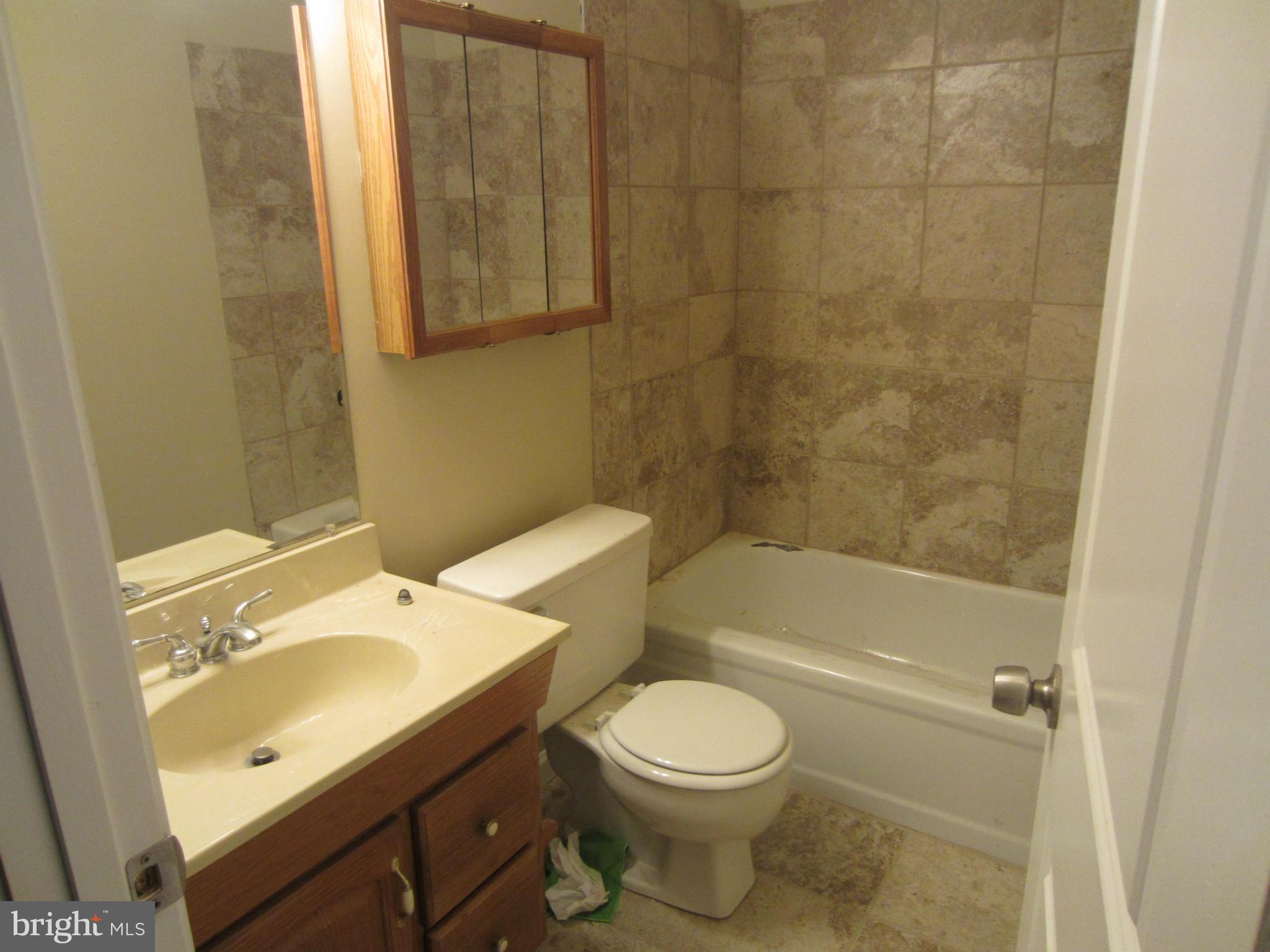418 Laburnum Road Edgewood, MD 21040 - Photo 15 of 27 a bathroom with a sink toilet and shower