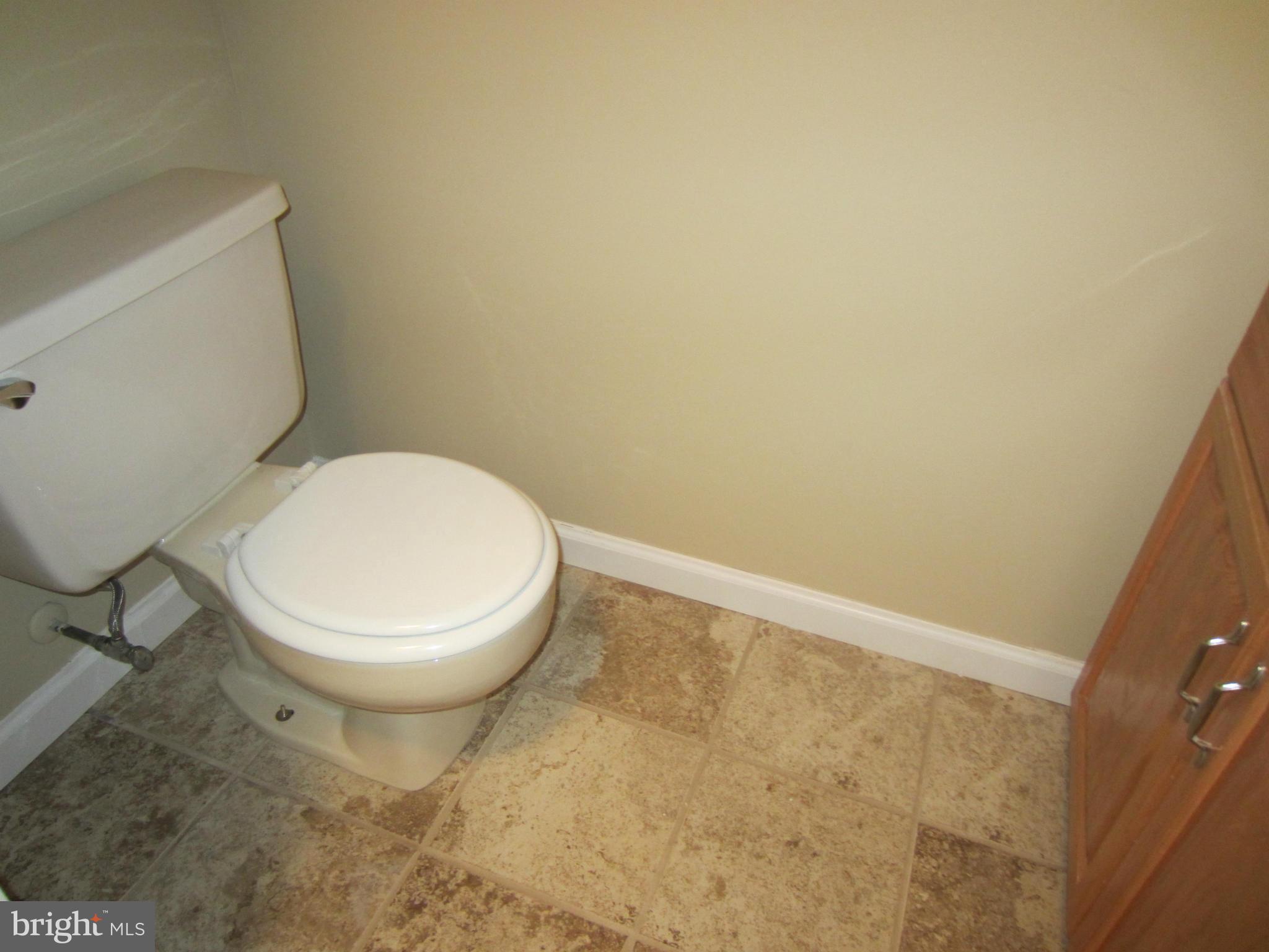 418 Laburnum Road Edgewood, MD 21040 - Photo 19 of 27 a white toilet sitting next to a white wall