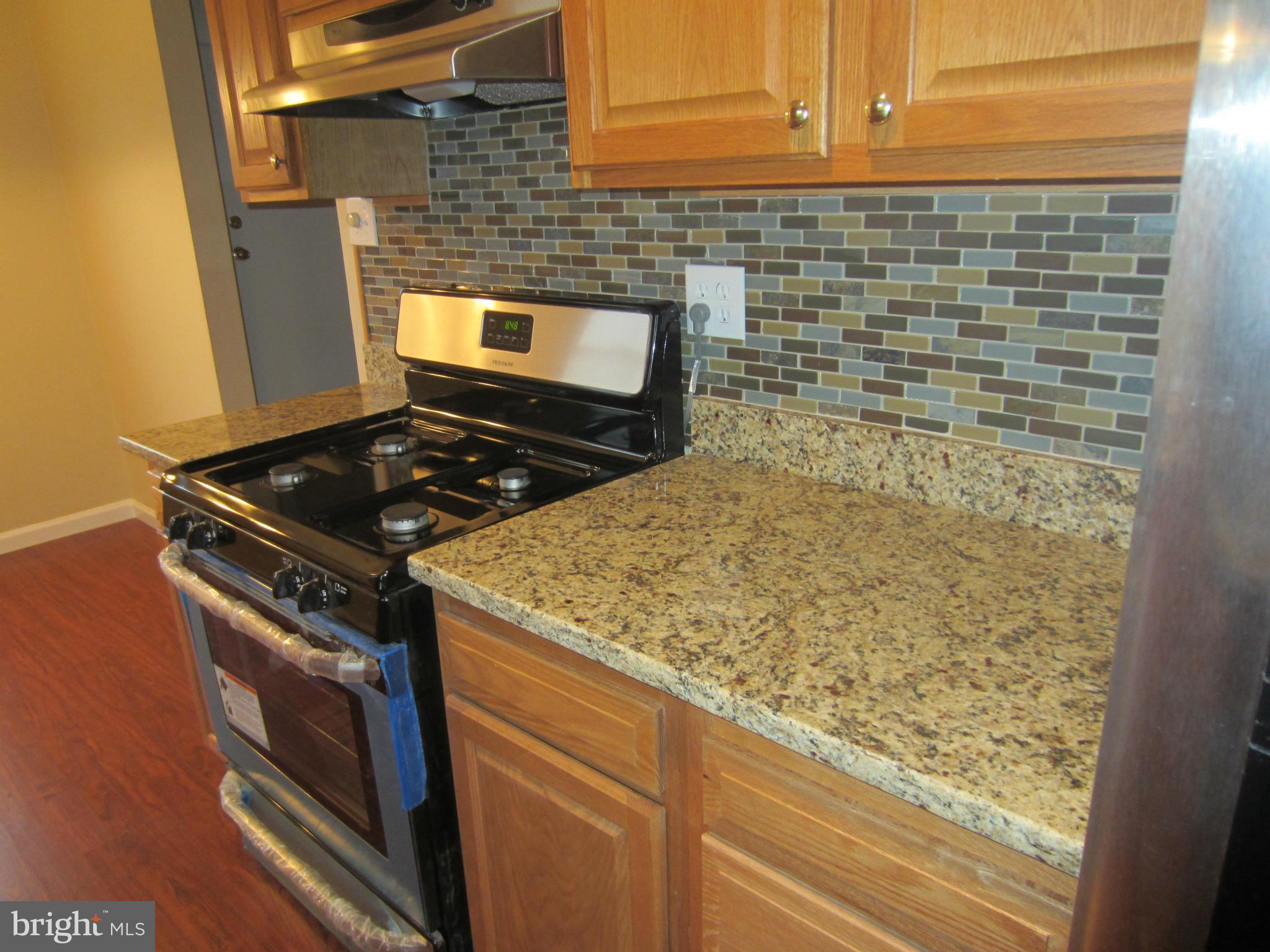 418 Laburnum Road Edgewood, MD 21040 - Photo 4 of 27 a stove top oven sitting inside of a kitchen