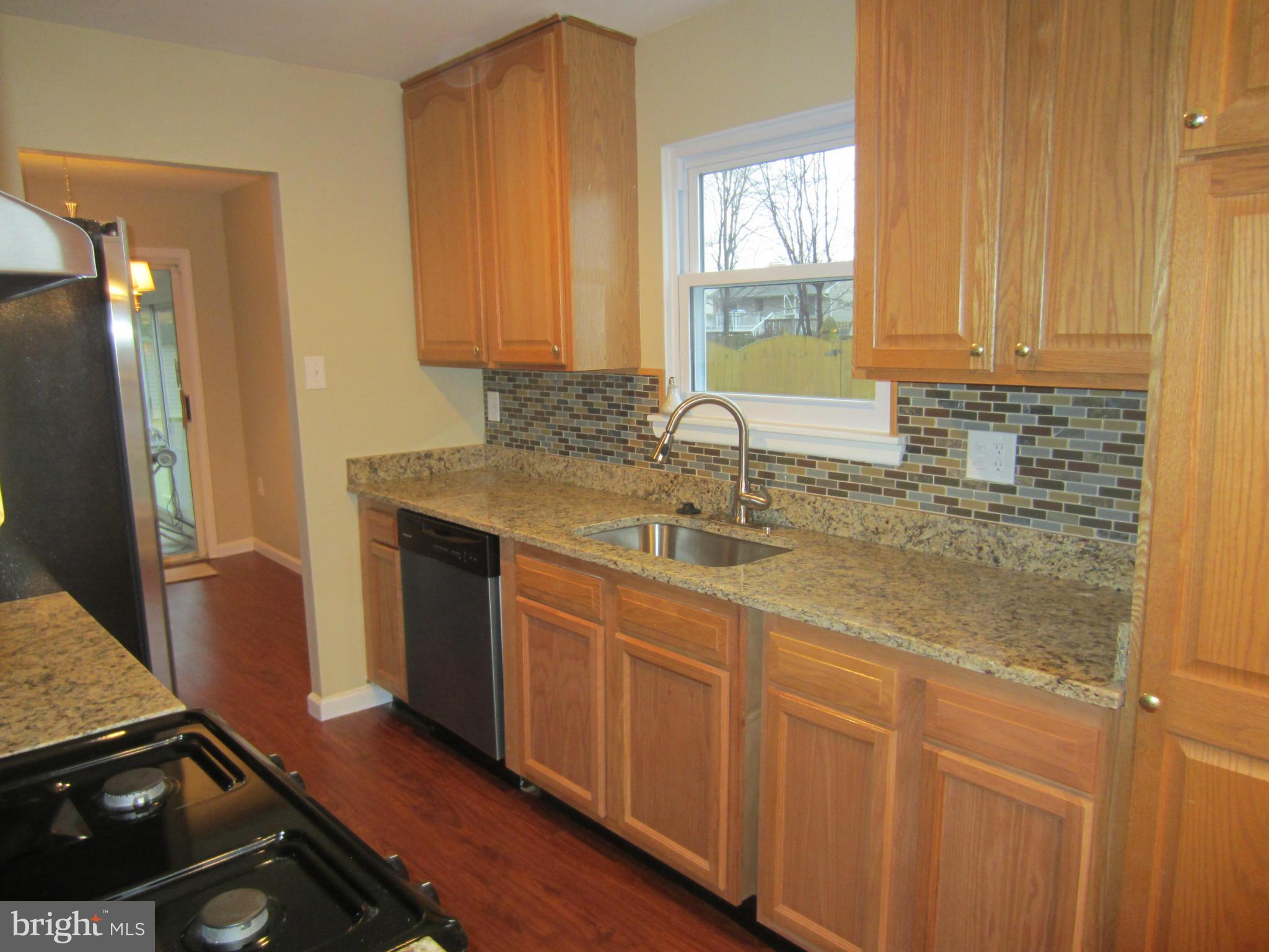 418 Laburnum Road Edgewood, MD 21040 - Photo 6 of 27 a kitchen with sink cabinets and window