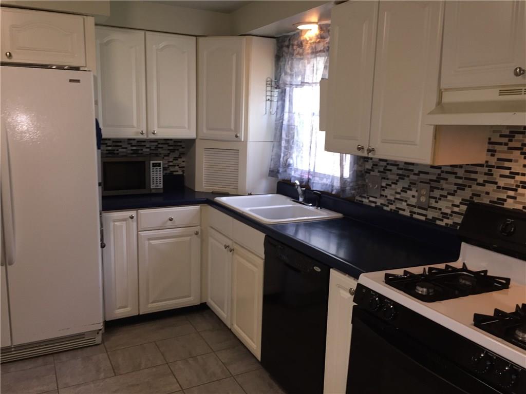 177 McIntyre Road Pittsburgh, PA 15237 - Photo 5 of 10 Easy to prepare meals in this roomy kitchen! Ceramic back splash, double bowl sinks and appliance garage just to name a few amenities!