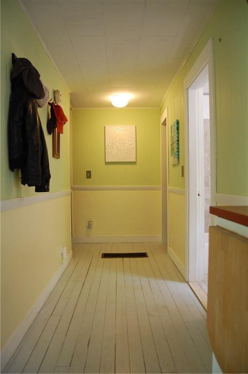 149 Camden Road Lincolnville, ME 04849 - Photo 8 of 20 This cheerful hall leads from the...