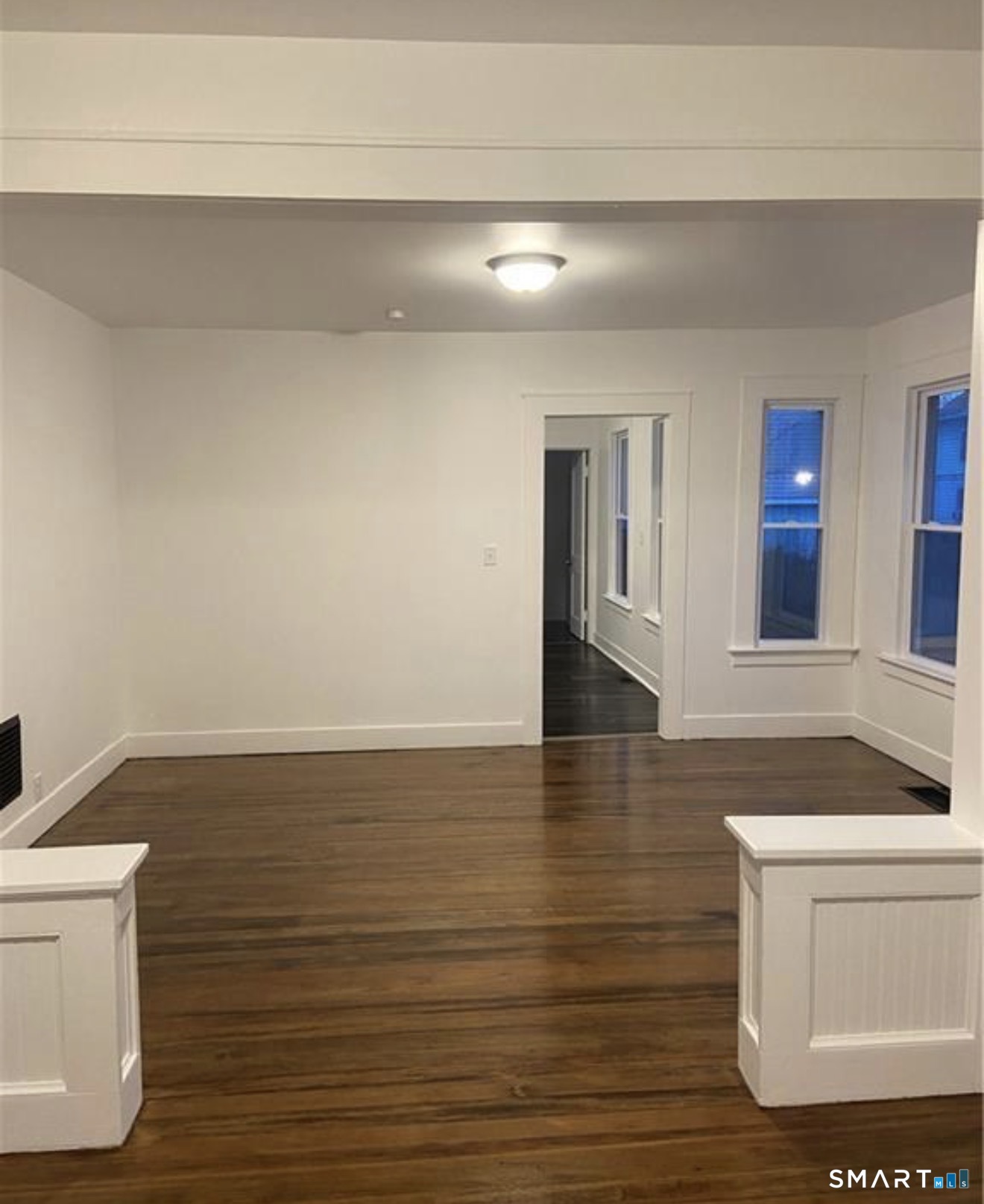 31 Winthrop Street Meriden, CT 06451 - Photo 7 of 8 a view of an empty room with wooden floor and cabinet