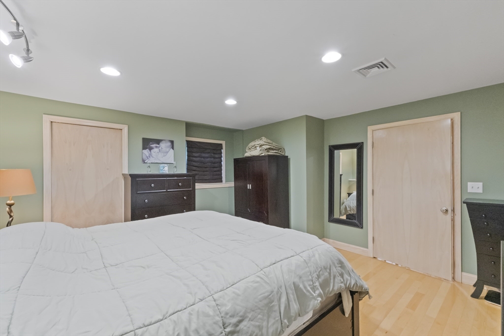 72 Ida Lane Fall River, MA 02720 - Photo 12 of 28 a bedroom with a large bed and a flat screen tv