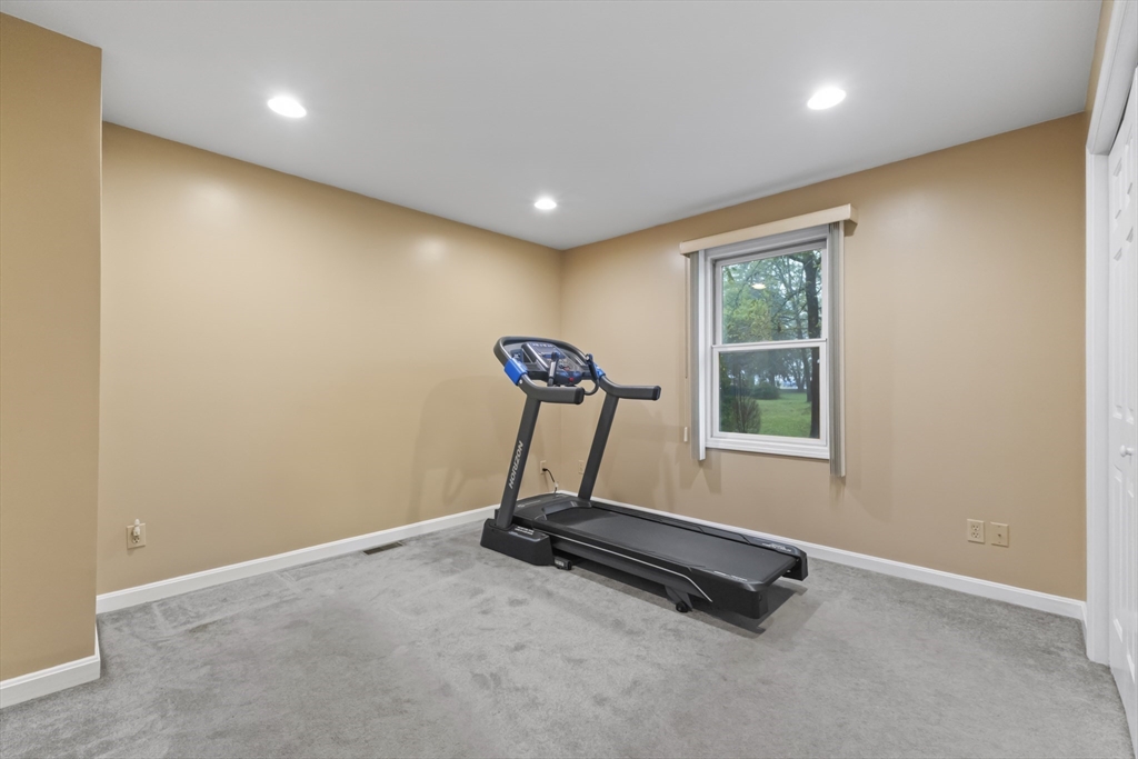 72 Ida Lane Fall River, MA 02720 - Photo 17 of 28 a room with gym equipment and a window
