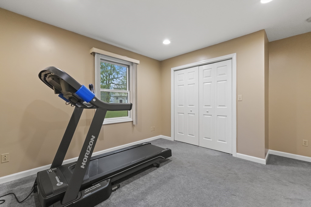 72 Ida Lane Fall River, MA 02720 - Photo 18 of 28 a view of a room with gym equipment