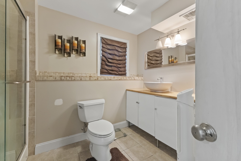 72 Ida Lane Fall River, MA 02720 - Photo 23 of 28 a bathroom with a toilet sink and mirror