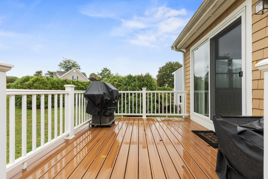 72 Ida Lane Fall River, MA 02720 - Photo 24 of 28 a balcony with wooden floor and fence