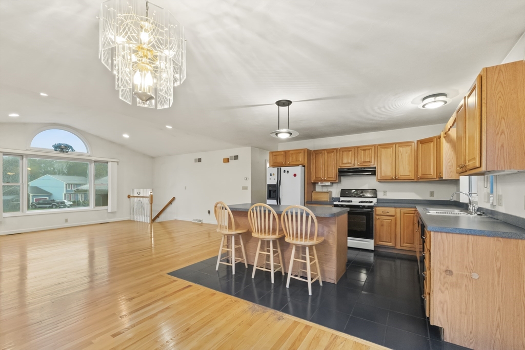 72 Ida Lane Fall River, MA 02720 - Photo 3 of 28 a large kitchen with a table and chairs