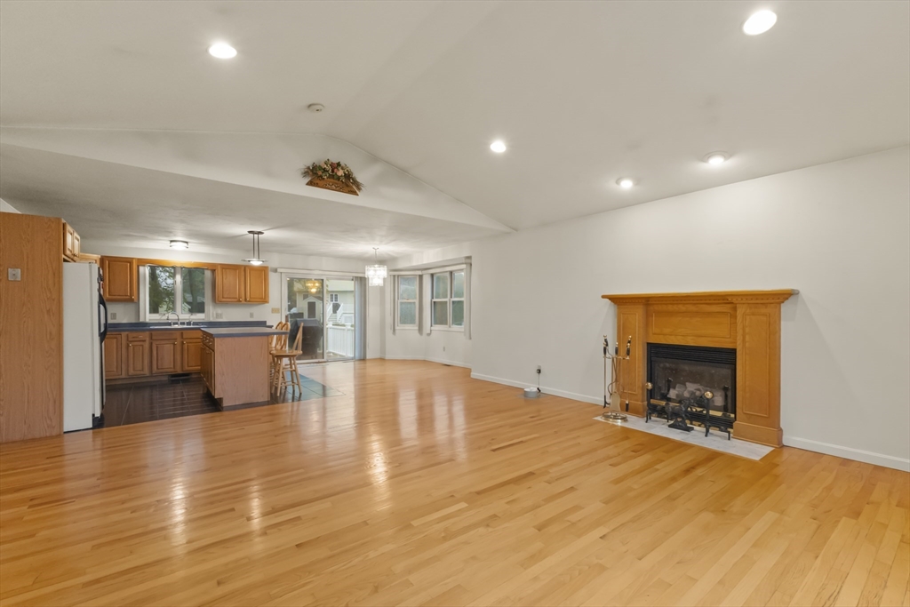 72 Ida Lane Fall River, MA 02720 - Photo 6 of 28 a view of a livingroom with furniture fire place and a fireplace