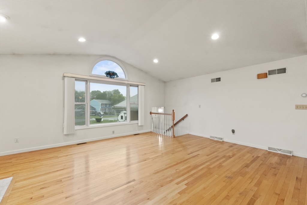 72 Ida Lane Fall River, MA 02720 - Photo 7 of 28 a view of empty room with wooden floor and fan