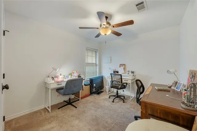 a view of a workspace with furniture