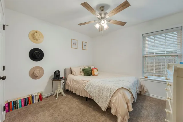 a bedroom with a bed and cabinets