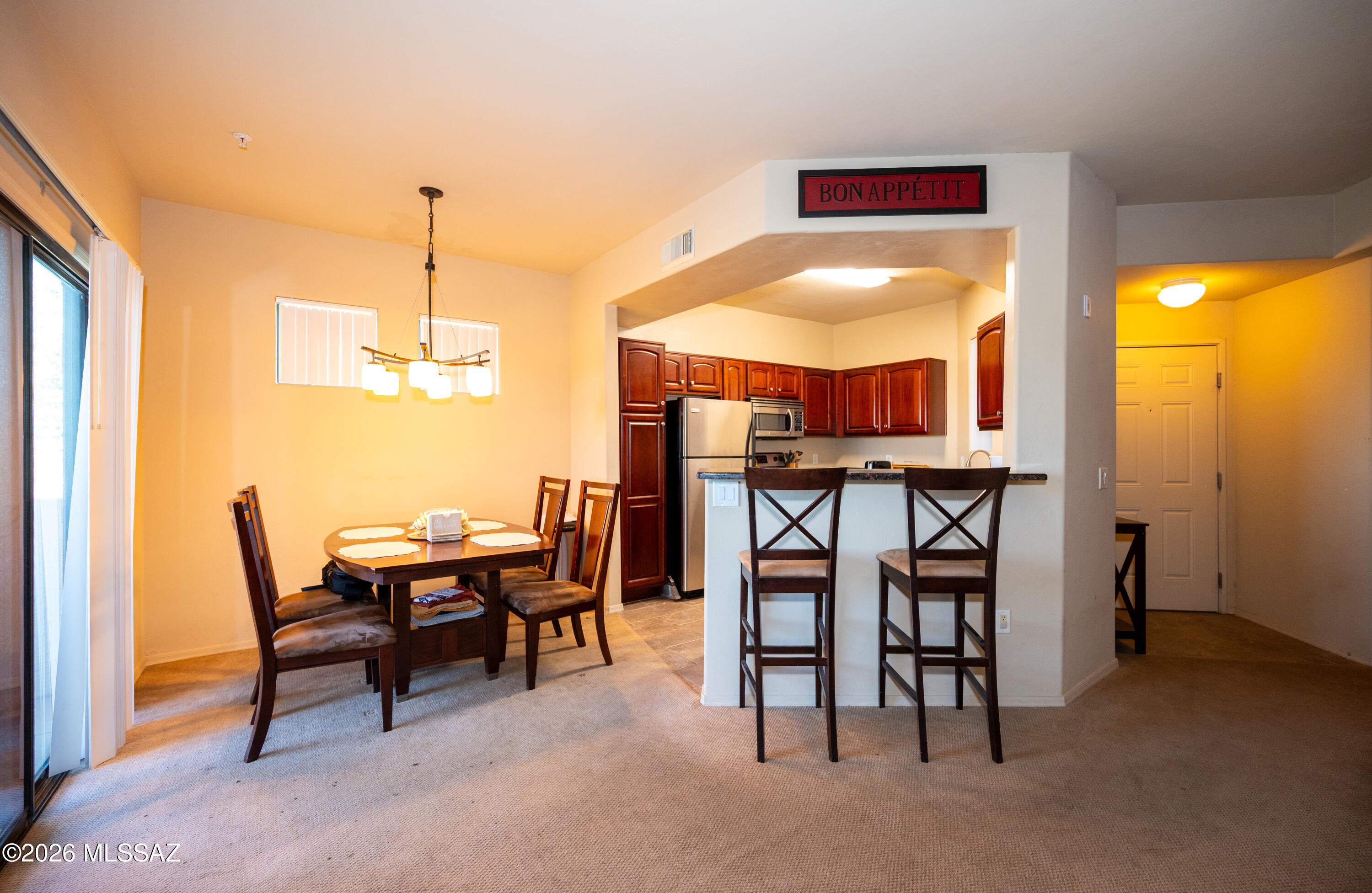 2550 East River Road, Unit 15303 Tucson, AZ 85718 - Photo 1 of 15 a dining room with furniture and window
