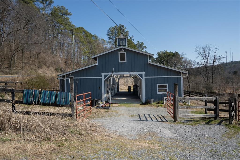55 East Green Ridge Road Southeast Cartersville, GA 30121 - Photo 4 of 6 a view of a house with a yard and a large tree