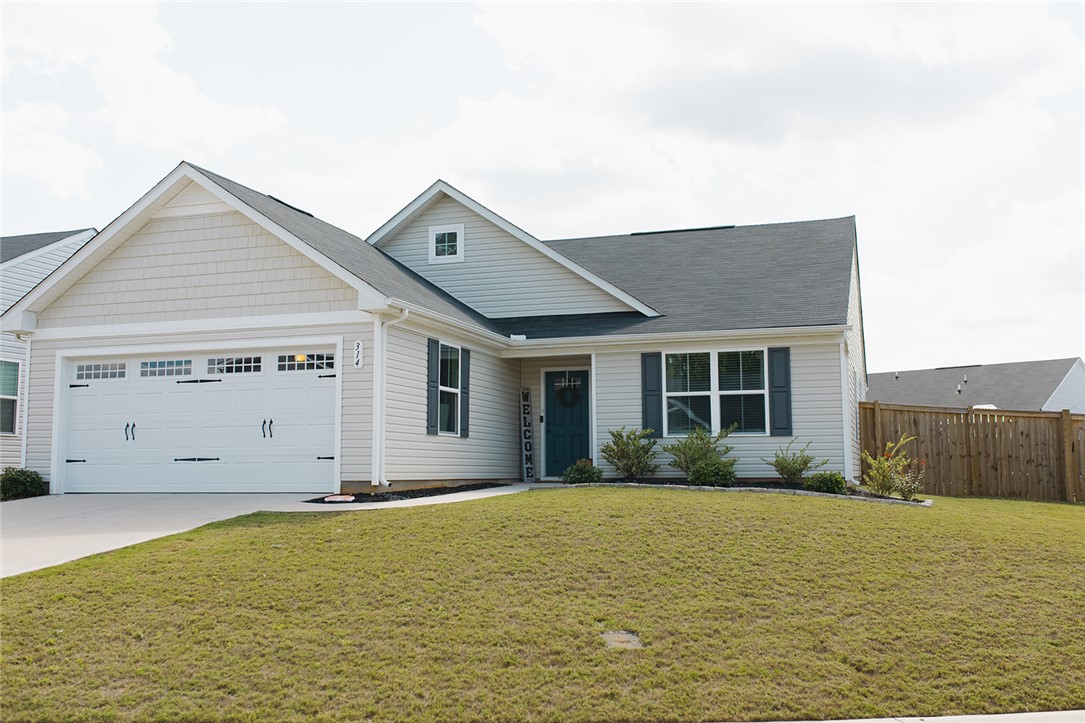 314 Callie Way Easley, SC 29642 - Photo 1 of 27 This charming home offers curb appeal with its inviting facade and well-maintained lawn.