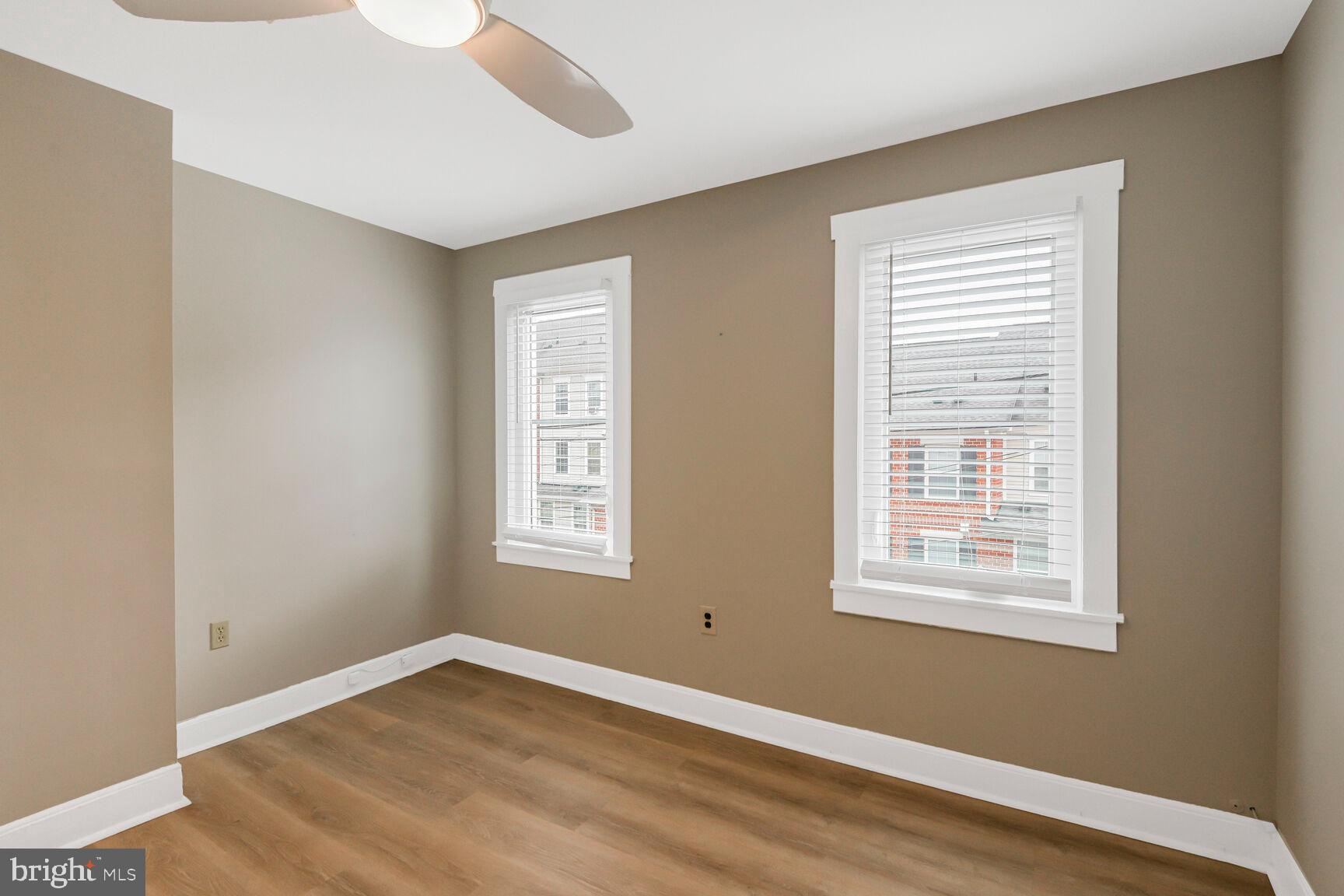 38 Pleasant Street Annapolis, MD 21401 - Photo 12 of 22 a view of an empty room with wooden floor and a window