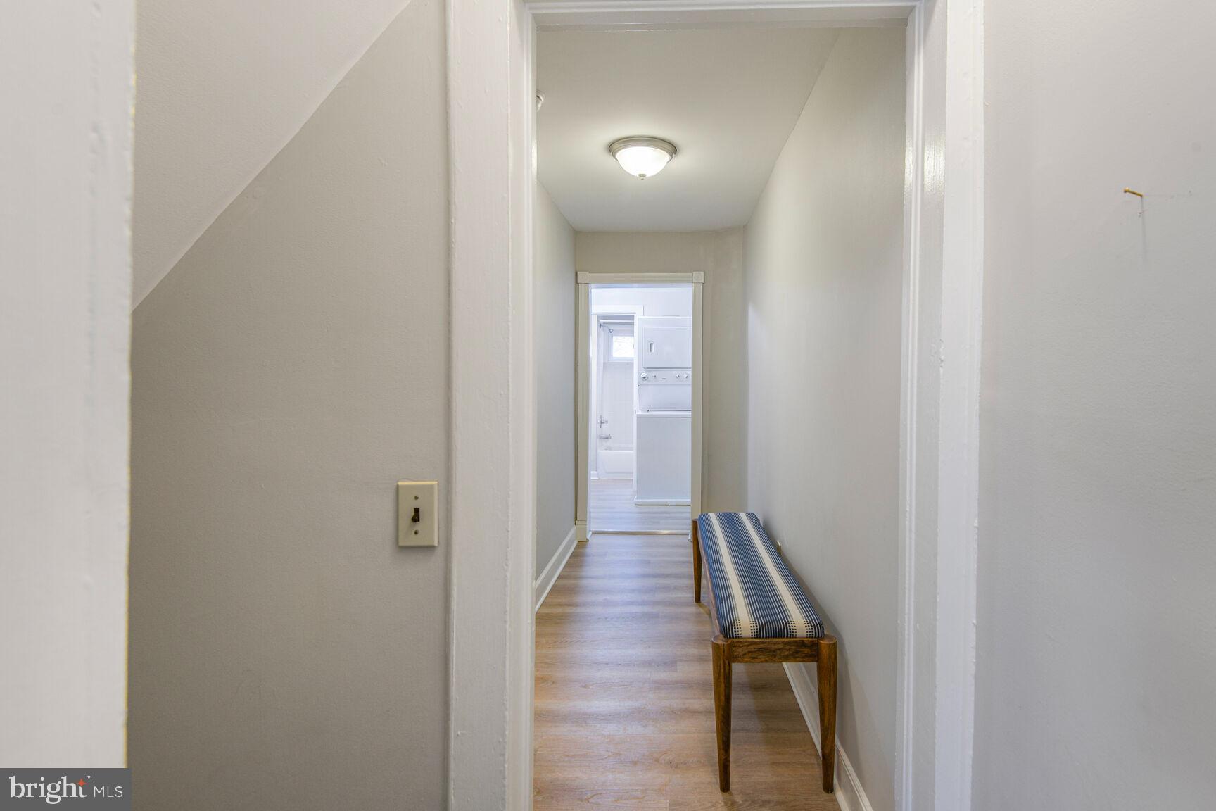 38 Pleasant Street Annapolis, MD 21401 - Photo 15 of 22 a view of a hallway with wooden floor and staircase
