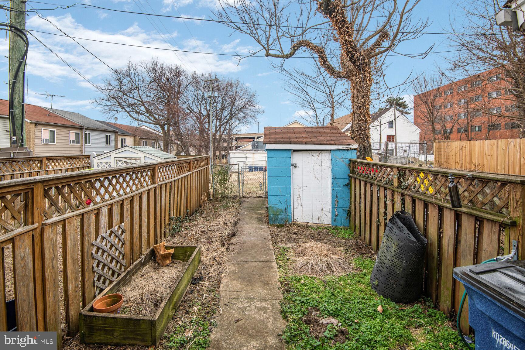 38 Pleasant Street Annapolis, MD 21401 - Photo 22 of 22 a view of a pathway of a house with wooden stairs and a fire pit