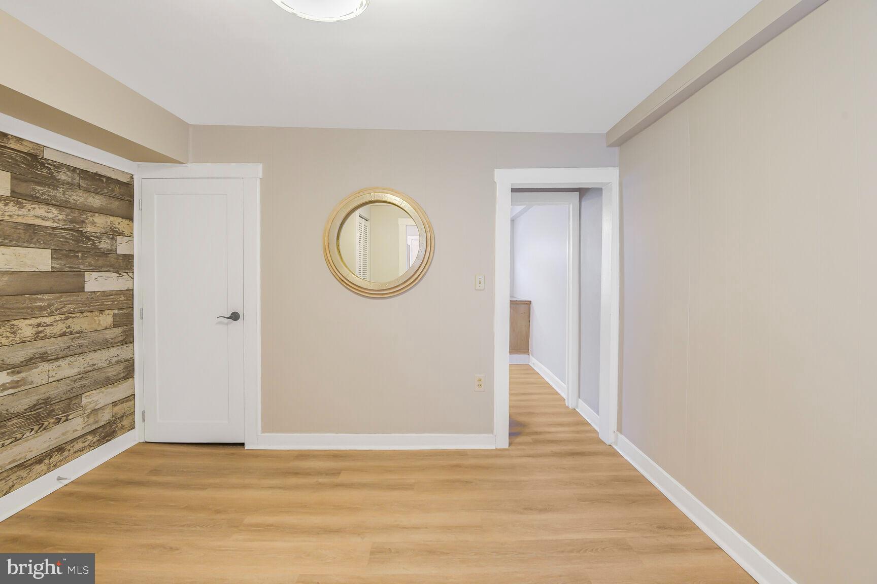 38 Pleasant Street Annapolis, MD 21401 - Photo 8 of 22 a view of a room with wooden floor and a staircase
