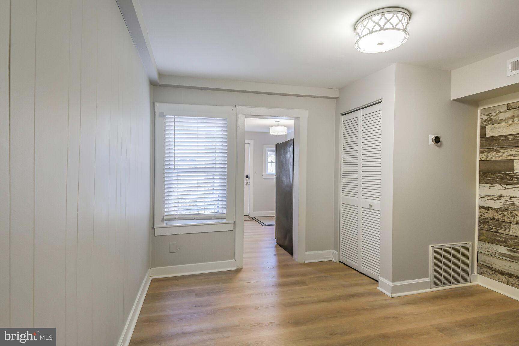 38 Pleasant Street Annapolis, MD 21401 - Photo 10 of 22 wooden floor in an empty room with a window
