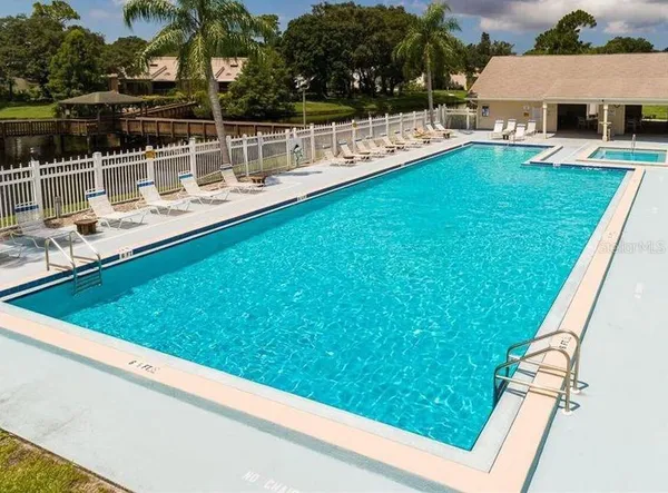 a view of swimming pool with a patio