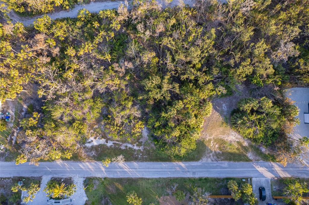 560 Gulf Bay Road Longboat Key, FL 34228 - Photo 17 of 38 a view of yard with outdoor seating