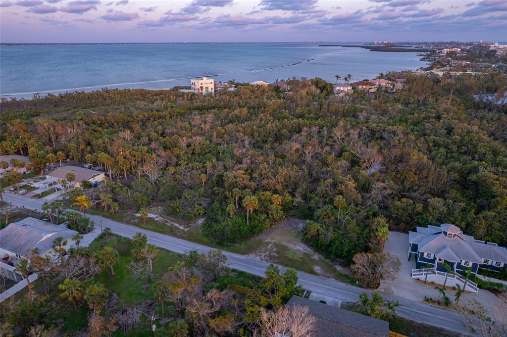 560 Gulf Bay Road Longboat Key, FL 34228 - Photo 18 of 38 an aerial view of residential house and green space