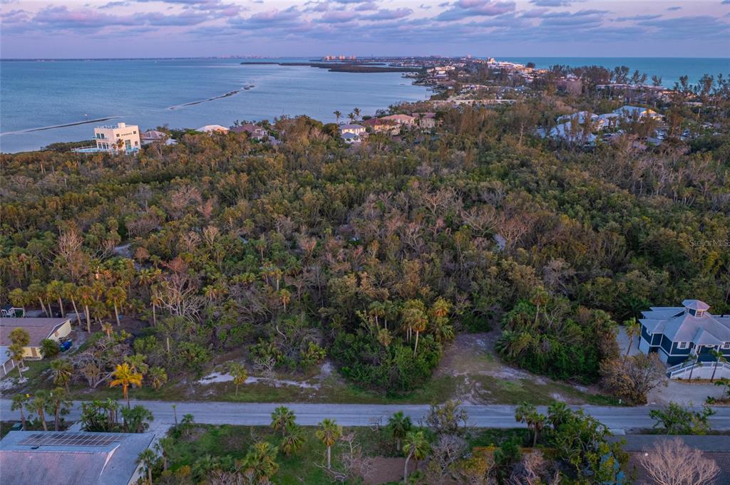 560 Gulf Bay Road Longboat Key, FL 34228 - Photo 30 of 38 an aerial view of a house with a yard