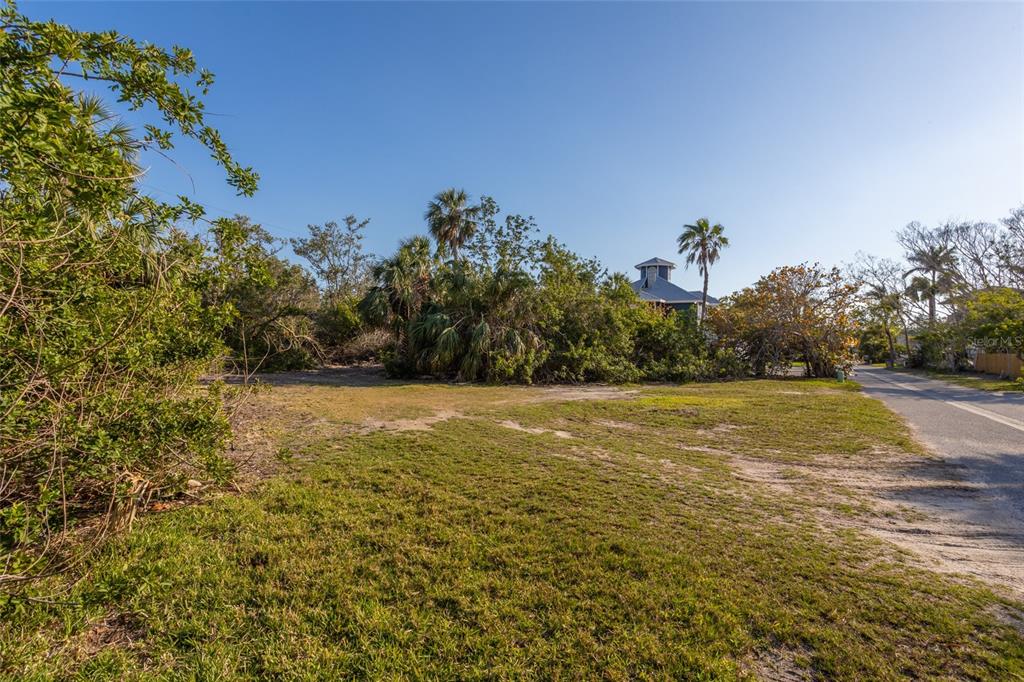 560 Gulf Bay Road Longboat Key, FL 34228 - Photo 32 of 38 a view of a field and trees