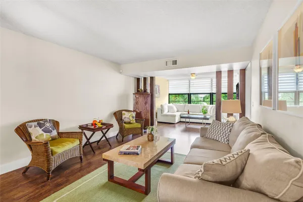a living room with furniture and a large window