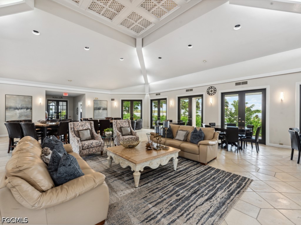 232 La Peninsula Boulevard, Unit 232 Naples, FL 34113 - Photo 41 of 44 a living room with furniture and a large window
