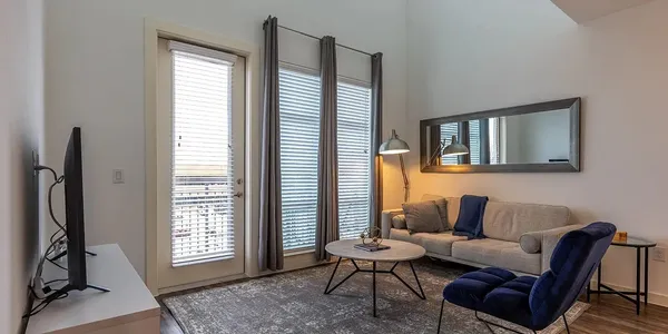 a living room with furniture and a window