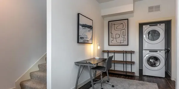 a view of a livingroom with washer and dryer