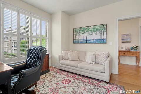 a living room with furniture and a rug