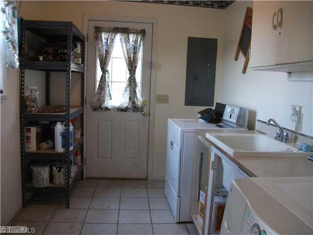 159 Foster Road Mocksville, NC 27028 - Photo 12 of 16 Laundry Room. Large laundry room with lots of storage, ceramic flooring and exterior access.