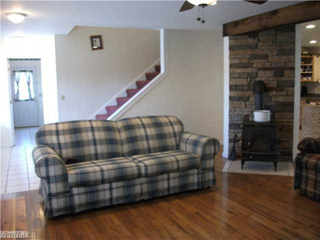 159 Foster Road Mocksville, NC 27028 - Photo 3 of 16 Living Room. Lovely hardwood floor with woodstove.