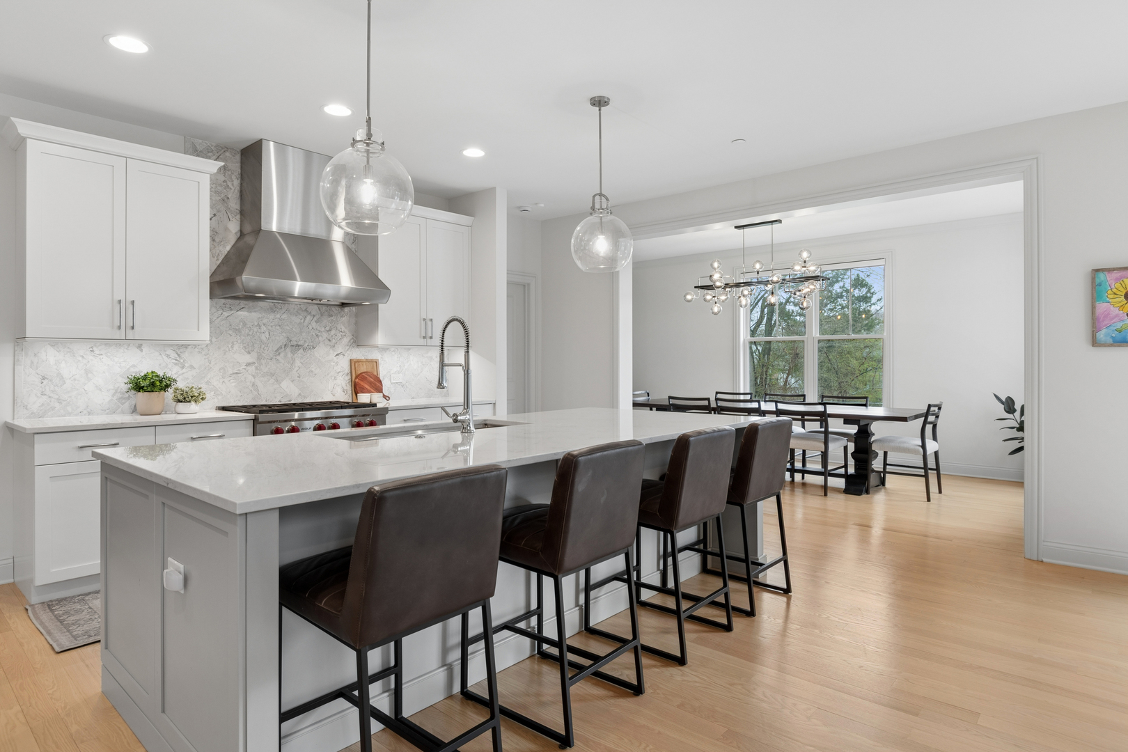 1759 Provenance Way Northbrook, IL 60062 - Photo 11 of 38 a kitchen with lots of counter space dining table and chairs