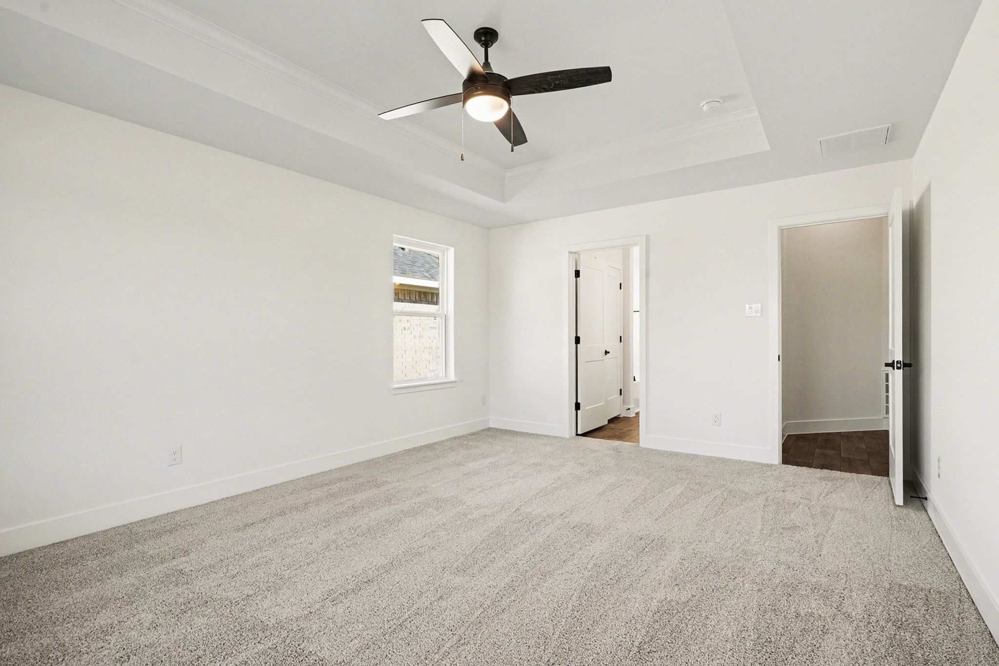 1 Keystone Court Angleton, TX 77515 - Photo 18 of 26 an empty room with fan and windows
