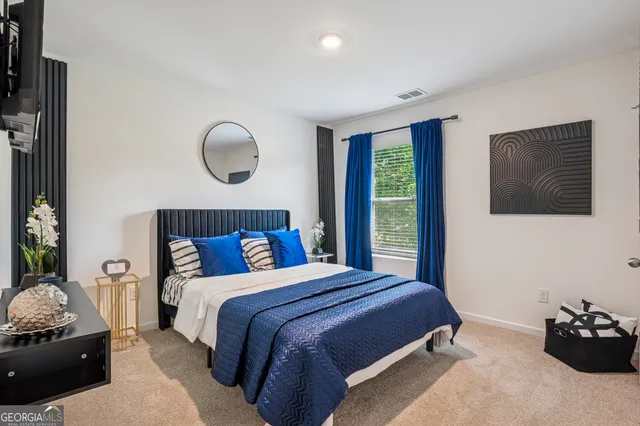 a bedroom with bed and window