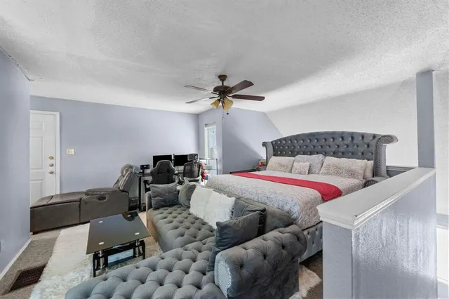 a bedroom with furniture and a chandelier