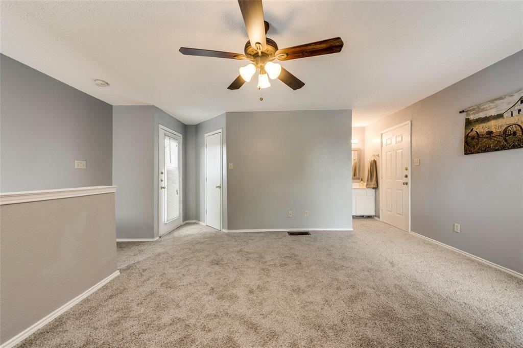 9815 Walnut Street, Unit 204 Dallas, TX 75243 - Photo 16 of 29 a view of an empty room with window and a ceiling fan