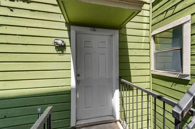 a view of a door and a window