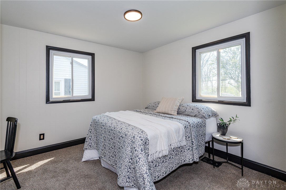 5240 Haverfield Road Dayton, OH 45432 - Photo 31 of 58 This restful bedroom features natural light and plush carpeting, creating a serene personal retreat.